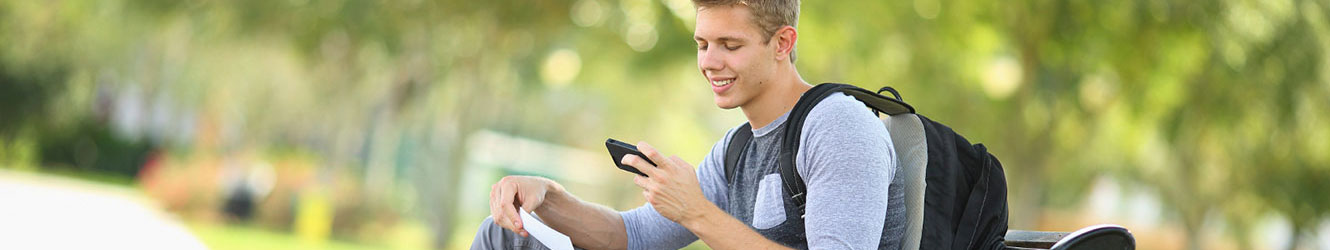 College student depositing a check with phone.