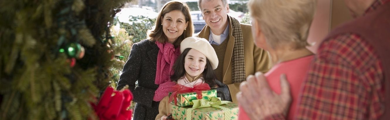 Man, woman and daughter visiting grandparents for Christmas